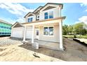 Charming two-story home featuring a two-car garage and covered porch, with gray and white trim at 1618 Trichel Dr, Greenwood, IN 46143