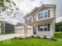 Charming two-story home featuring a spacious three-car garage and well-manicured front lawn at 1618 Trichel Dr, Greenwood, IN 46143