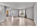 Bright living room featuring hardwood floors and ample natural light at 2011 Blue Pine Ln, Indianapolis, IN 46231