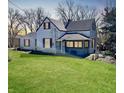 Cozy home featuring a well-manicured lawn and inviting front porch at 3120 Central Ave, Anderson, IN 46016