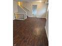 Welcoming living room with hardwood floors and staircase at 4126 Flamingo West Dr, Indianapolis, IN 46226