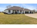 Gorgeous ranch-style home with manicured lawn and three car garage at 5529 W Mccord Rd, McCordsville, IN 46055