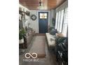 Charming entryway featuring a wooden ceiling, decorative accents, and a cozy daybed at 5951 W St Rd 32 W, Anderson, IN 46011