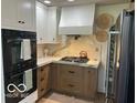 Gourmet kitchen with marble countertops, stainless steel appliances, and custom cabinetry at 5951 W St Rd 32 W, Anderson, IN 46011