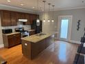Well-equipped kitchen featuring granite countertops, stainless steel appliances, and a functional island at 614 E 11Th St, Indianapolis, IN 46202