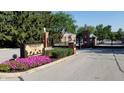 Gated entrance to Lions Head featuring manicured landscaping at 7434 King George Dr # A, Indianapolis, IN 46260