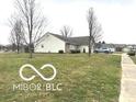 A nicely landscaped yard and sidewalk lead to this attractive single-story house at 1001 Maple W Dr, Lebanon, IN 46052