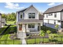 Attractive two-story home featuring a well-manicured lawn and inviting front entrance at 11505 Langton Walk, Zionsville, IN 46077