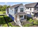 Charming two-story home with a welcoming front porch and beautifully landscaped yard at 11505 Langton Walk, Zionsville, IN 46077