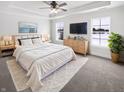Spacious main bedroom with tray ceiling, plush carpet, and bright natural light at 13820 N Honey Creek Dr, Camby, IN 46113