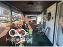 Relaxing front porch adorned with plants and seating offers an inviting outdoor living space at 1405 N Mount St, Indianapolis, IN 46222