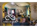Cozy living room featuring an archway, ceiling fan, and natural light at 1405 N Mount St, Indianapolis, IN 46222