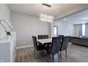 Inviting dining area with elegant table and chairs, complemented by stylish lighting at 3581 Free Spirit Ct, Westfield, IN 46074