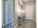 Welcoming hallway featuring stylish console table and decorative artwork at 3581 Free Spirit Ct, Westfield, IN 46074