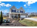 Beautiful two-story home with a three-car garage and attractive landscaping at 4052 Saddle Club S Pkwy, Bargersville, IN 46106