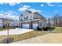 Stunning two-story home boasts a three-car garage and a neatly maintained lawn at 4052 Saddle Club S Pkwy, Bargersville, IN 46106