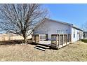 Backyard wooden deck perfect for outdoor entertaining with a tree at 888 Streamside Dr, Greenfield, IN 46140