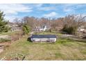 High aerial view of a charming property with a well-maintained lawn and a barn at 9531 Prospect St, Indianapolis, IN 46239