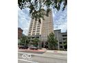 Exterior shot of building showing mature trees, and a red crosswalk in front at 110 E Washington St # 802, Indianapolis, IN 46204