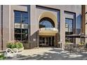 Beautiful exterior view of the building with large windows and outdoor seating area at 110 E Washington St # 802, Indianapolis, IN 46204