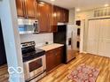 Features updated stainless appliances, granite counters, and wood cabinets at 110 E Washington St # 802, Indianapolis, IN 46204