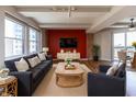 Cozy living room featuring comfortable seating, a media center, and a dining area with large windows at 110 E Washington St # 802, Indianapolis, IN 46204