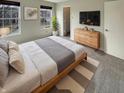 Bright bedroom with natural light, features modern decor and a comfortable layout at 12416 Teacup Way, Indianapolis, IN 46235