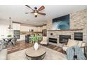 Inviting living room with stone fireplace, open to kitchen, and modern decor at 13082 Overview Dr # 5A, Fishers, IN 46037