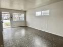Bright living room with neutral walls, large windows, and vinyl floors at 151 N 8Th Ave, Beech Grove, IN 46107