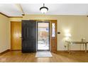 Bright foyer with wood flooring, front door, and adjacent coat closet, offering a welcoming entrance at 153 Monticello Ct, Noblesville, IN 46060