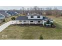A bird's-eye view showcases this home's beautiful architecture and expansive green lawn in a peaceful neighborhood at 19041 Karyn Ln, Westfield, IN 46062