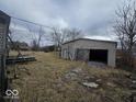 Spacious detached garage offering ample storage and workspace with a weathered exterior at 2420 N Macedonia Ave, Muncie, IN 47303