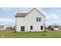 Spacious backyard featuring a well-manicured lawn and a modern white two-story home at 250 Evening Bay Ct, Pendleton, IN 46064