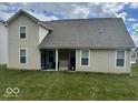 The back of the house features an open patio and backyard lawn at 2536 Lanai Ln, Greenwood, IN 46143