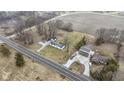 Aerial view featuring a house with a long driveway and a large lot, complemented by nearby wooded area at 4251 W 176Th St, Sheridan, IN 46069