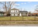 Charming home with a fenced front yard, offers great curb appeal and a sense of privacy at 4407 Barnor Dr, Indianapolis, IN 46226