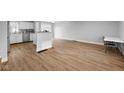 Open-concept living room features hardwood floors and white paint, creating a bright and airy space at 4407 Barnor Dr, Indianapolis, IN 46226