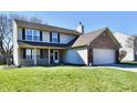 Two-story house with a well-kept lawn and an attached two car garage at 576 Port Dr, Avon, IN 46123