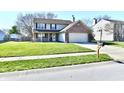 Charming two-story home with a well-manicured lawn and classic architectural details at 576 Port Dr, Avon, IN 46123