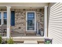 Inviting entryway with decorative door, sidelights, and brick columns at 5806 Belvista Dr, Plainfield, IN 46168