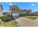Charming two-story home with a long driveway, front yard and traditional architectural design at 8153 Fivespot Ln, Plainfield, IN 46168