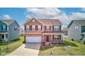 Charming two-story home with a two car garage and landscaped front yard at 8153 Fivespot Ln, Plainfield, IN 46168