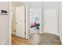 Bright entryway featuring wood floors, with views of a bedroom and bathroom at 887 Tuxedo Dr, Westfield, IN 46074