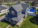 Beautiful two-story home with in-ground pool and well-maintained lawn at 97 N Maple St, Pittsboro, IN 46167