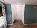 Inviting entryway featuring stylish paint, durable wood floors, and ample natural light at 11403 Fairweather Pl, Indianapolis, IN 46229