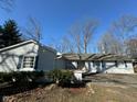 Well-maintained single-story house featuring light siding and a well-manicured lawn at 1536 W 74Th Pl, Indianapolis, IN 46260