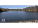 Expansive lake view under a bright sky, highlighting the serene and natural setting of the property at 155 Boring Pl, Martinsville, IN 46151