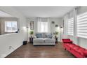 Bright living room with modern decor, laminate floors and large windows that provide natural light at 1731 N Campbell Ave, Indianapolis, IN 46218