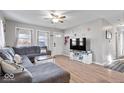 Open-concept living room with hardwood flooring, neutral walls, and a comfortable seating area, ideal for relaxation at 300 Indiana Ave, Pendleton, IN 46064