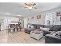 Bright living room open to dining and kitchen area, features hardwood flooring and lots of natural light at 300 Indiana Ave, Pendleton, IN 46064